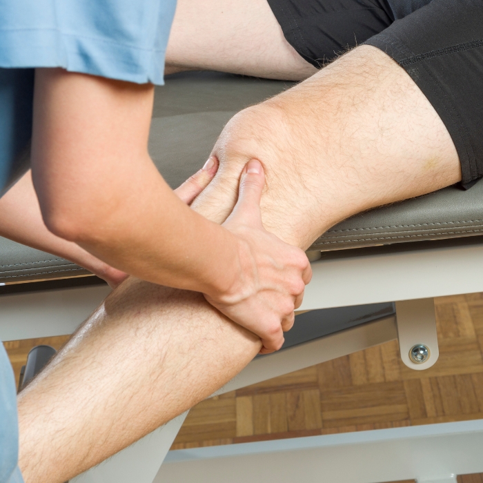 chiropractor-checking-woman-leg-and-knee-adams-county-pa